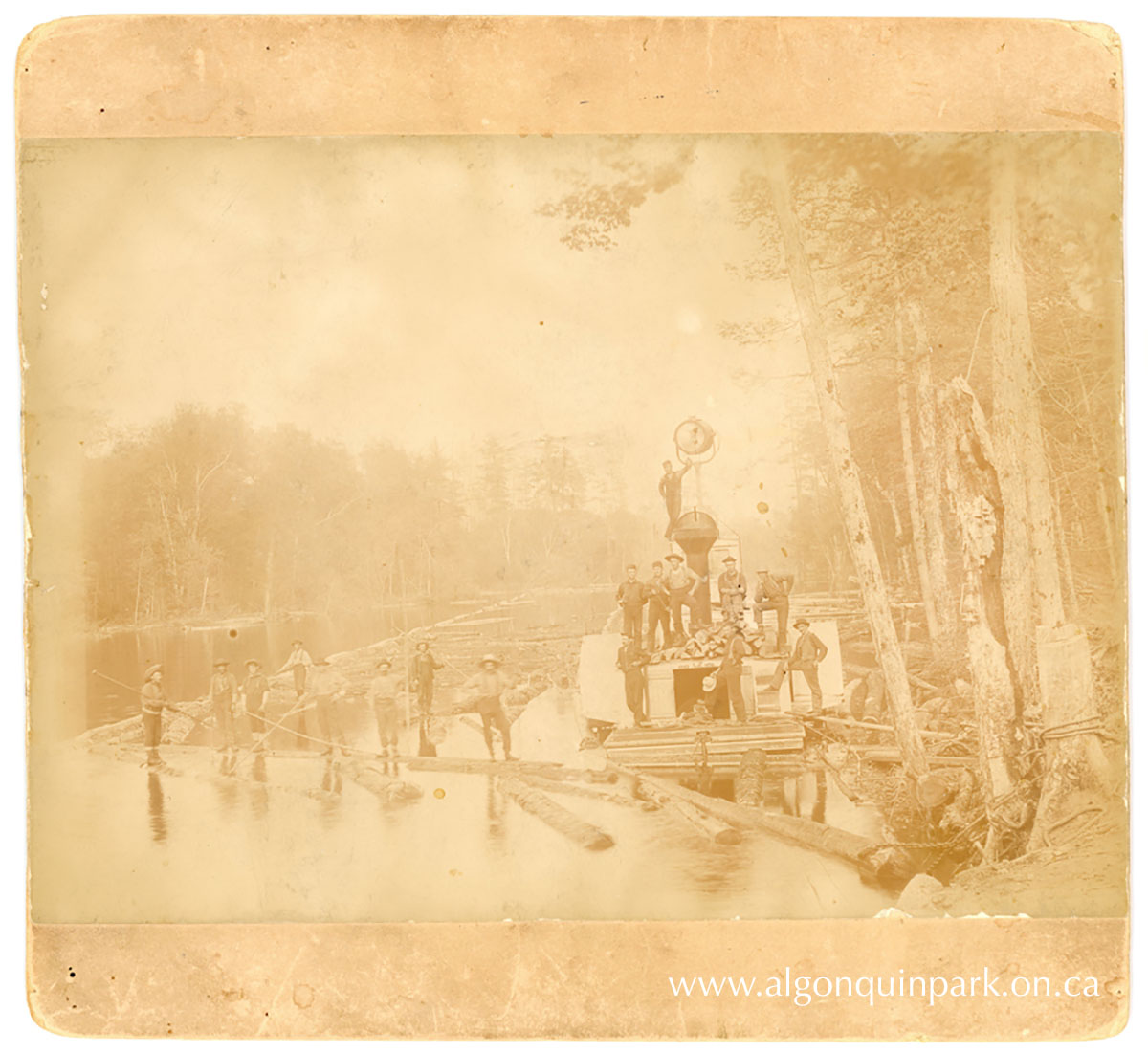 Gilmour Lumber Co. men on Tramway Pond, transporting logs to Raven Lake and eventually St. Nora Lake, c. 1894 - 1896. Note the spotlight on top! Work continued day and night to move as many logs as possible. APPAC, 2024.33.2, In memory of Patrick O'Neill and Michael Joseph O'Neill. 