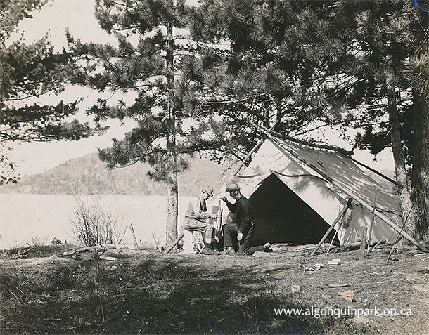 Weighing a fish in front of one of the tents at the fishing party’s camp at Grand Lake, 1925. Bottom – Paddling “Under the palisades of the Petawawa River”, 1925. APPAC, x2024.4.1-77. 
